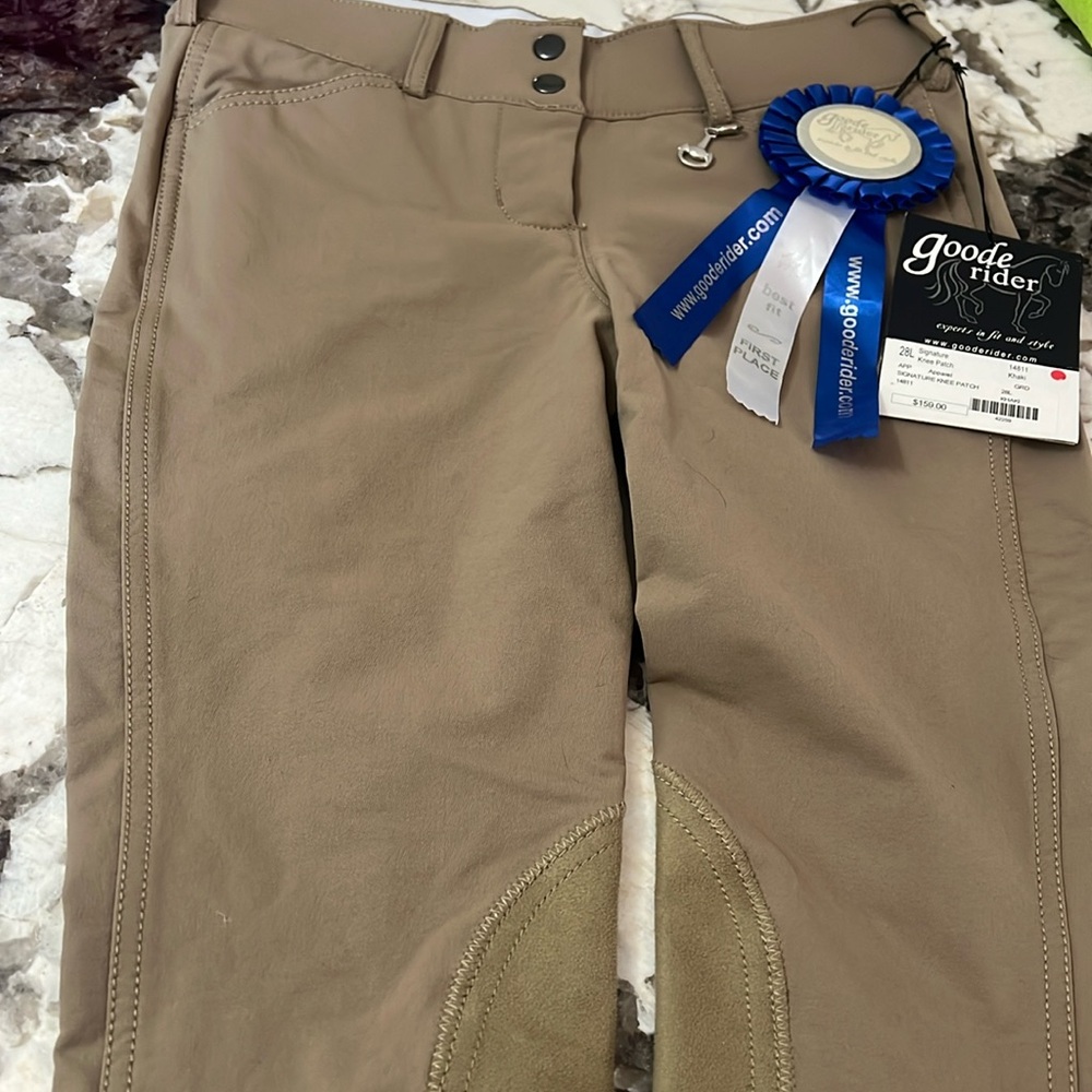 Brand new with tag size 28 long good rider pants.